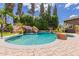 Backyard pool with slide and waterfall feature at 1907 E Huber St, Mesa, AZ 85203