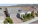 A charming single-story home with mature landscaping, brick driveway, and desert surroundings at 19215 N 259Th Ave, Buckeye, AZ 85396