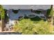 Aerial view of beautifully landscaped backyard with patio and manicured lawn at 19215 N 259Th Ave, Buckeye, AZ 85396