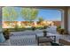 Lush backyard with manicured landscaping, a paved patio, and cozy seating area with a fire pit at 19215 N 259Th Ave, Buckeye, AZ 85396