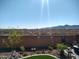 Backyard view featuring desert landscaping, mountain views, and privacy wall at 19215 N 259Th Ave, Buckeye, AZ 85396