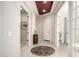 Bright entryway with tiled floors, decorative rug, white walls, and attractive accent lighting at 19215 N 259Th Ave, Buckeye, AZ 85396