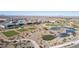 Scenic aerial view of a golf course alongside a water feature in a residential community at 19215 N 259Th Ave, Buckeye, AZ 85396