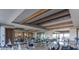 Spacious gym featuring modern stationary bikes, mirrored walls and bright recessed lighting at 19215 N 259Th Ave, Buckeye, AZ 85396