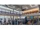 Sun City Festival fitness center with modern equipment and floor-to-ceiling windows at 19215 N 259Th Ave, Buckeye, AZ 85396