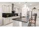 Modern kitchen featuring granite countertops, stainless steel appliances, and a breakfast bar at 19215 N 259Th Ave, Buckeye, AZ 85396