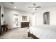 A primary bedroom featuring neutral carpet, a dresser, and a doorway to an outdoor patio at 19215 N 259Th Ave, Buckeye, AZ 85396