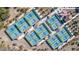 Aerial view of multiple pickleball courts with blue and green surfaces and shaded seating areas at 19215 N 259Th Ave, Buckeye, AZ 85396
