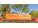 Sun City Festival community entrance sign amidst colorful flowers and lush greenery at 19215 N 259Th Ave, Buckeye, AZ 85396