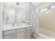 Bathroom featuring a tub with shower, decorative shower curtain, and gray vanity at 1961 N Hartford St # 1087, Chandler, AZ 85225