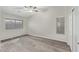 Empty bedroom features hard surface floors, light gray walls, and ample natural light at 1961 N Hartford St # 1087, Chandler, AZ 85225