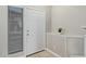Bright entryway featuring neutral paint, a white door, and a decorative plant at 1961 N Hartford St # 1087, Chandler, AZ 85225