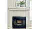 Classic fireplace mantel adds warmth and elegance to the living space at 1961 N Hartford St # 1087, Chandler, AZ 85225
