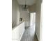 Upstairs hallway features hard surface floors, light gray walls, and a black chandelier at 1961 N Hartford St # 1087, Chandler, AZ 85225