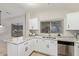 Bright kitchen features stainless steel appliances, white cabinets, granite countertops and natural light at 1961 N Hartford St # 1087, Chandler, AZ 85225