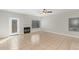 Spacious living room with tiled floors, fireplace, and plenty of natural light at 1961 N Hartford St # 1087, Chandler, AZ 85225