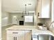 Inviting living room showcases fireplace, natural light, open floorplan, and stylish finishes for comfortable living at 1961 N Hartford St # 1087, Chandler, AZ 85225