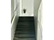 Staircase with hard surface steps, white risers, and white handrail at 1961 N Hartford St # 1087, Chandler, AZ 85225