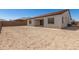 Backyard showcasing the home's exterior, patio, and large space for outdoor living at 20255 W Monterey Way, Buckeye, AZ 85396