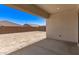 Covered patio in the backyard with room for future landscape design at 20255 W Monterey Way, Buckeye, AZ 85396