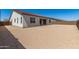 Exterior of home showcasing an expansive backyard ready for landscaping or customization at 20255 W Monterey Way, Buckeye, AZ 85396