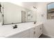Modern bathroom with a double sink vanity, large mirror and stylish fixtures at 20255 W Monterey Way, Buckeye, AZ 85396