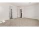 Spacious carpeted bedroom with ensuite bathroom with tiled walk-in shower and an adjacent doorway at 20255 W Monterey Way, Buckeye, AZ 85396