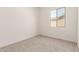 Bright bedroom with neutral carpet and natural light from the window at 20255 W Monterey Way, Buckeye, AZ 85396