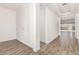 A clean and modern hallway featuring tile floors and bright white walls at 20255 W Monterey Way, Buckeye, AZ 85396