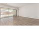 Open living space with tile flooring and sliding glass doors leading to the backyard patio at 20255 W Monterey Way, Buckeye, AZ 85396