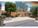 Well-manicured backyard with lush landscaping, patio area, and privacy wall at 20523 N 267Th Ln, Buckeye, AZ 85396