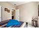 Bedroom with a comfortable bed and an open door that leads to the bathroom at 20523 N 267Th Ln, Buckeye, AZ 85396