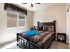 Cozy bedroom with a comfortable bed, ceiling fan, and neutral decor at 20523 N 267Th Ln, Buckeye, AZ 85396