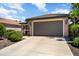 Lovely single-story home showcasing a large two-car garage and beautiful landscaping at 20523 N 267Th Ln, Buckeye, AZ 85396