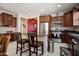 Well-equipped kitchen featuring stainless steel appliances, granite countertops and breakfast bar seating at 20523 N 267Th Ln, Buckeye, AZ 85396