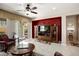 Inviting living room features tile flooring, entertainment center, ceiling fan and access to the backyard at 20523 N 267Th Ln, Buckeye, AZ 85396