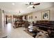 Spacious living room with tile flooring, recessed lighting, and comfortable seating arrangement at 20523 N 267Th Ln, Buckeye, AZ 85396