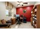Comfortable office space with natural light, a ceiling fan and a cozy chair at 20523 N 267Th Ln, Buckeye, AZ 85396