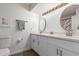 Bright bathroom featuring dual sinks, modern fixtures, and stylish mirrors, enhancing its appeal at 2109 W El Alba Way, Chandler, AZ 85224