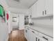 Open hallway featuring bright countertops, plenty of storage and easy access to bedrooms at 2109 W El Alba Way, Chandler, AZ 85224