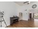 Open living area featuring a piano, telescope, and easy access to other rooms at 2109 W El Alba Way, Chandler, AZ 85224