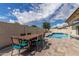Backyard features a dining area and a beautiful swimming pool, perfect for entertaining at 2109 W El Alba Way, Chandler, AZ 85224