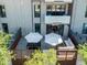 Overhead view of outdoor patios with seating, dining areas, and privacy screens at 2300 E Campbell Ave # 106, Phoenix, AZ 85016