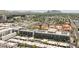 Stunning aerial view of a residential area with multi-story buildings and mountain views in the distance at 2300 E Campbell Ave # 106, Phoenix, AZ 85016