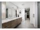 Large bathroom with double vanity, walk-in closet, and a sleek, modern design at 2300 E Campbell Ave # 106, Phoenix, AZ 85016