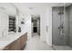 Modern bathroom featuring double sinks, a shower, and plenty of storage space at 2300 E Campbell Ave # 106, Phoenix, AZ 85016