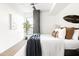 Bright bedroom featuring hardwood floors, a ceiling fan and a neutral color palette at 2300 E Campbell Ave # 106, Phoenix, AZ 85016