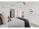 Inviting bedroom with a view into the home's modern kitchen at 2300 E Campbell Ave # 106, Phoenix, AZ 85016