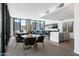 Bright community room with stylish seating, dining tables, and kitchenette at 2300 E Campbell Ave # 106, Phoenix, AZ 85016
