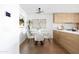Bright dining area with contemporary lighting and a view of the kitchen at 2300 E Campbell Ave # 106, Phoenix, AZ 85016